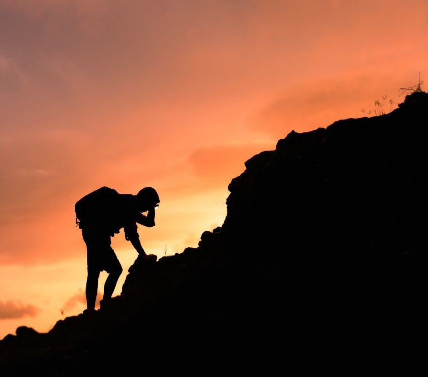 A person climbing a mountain